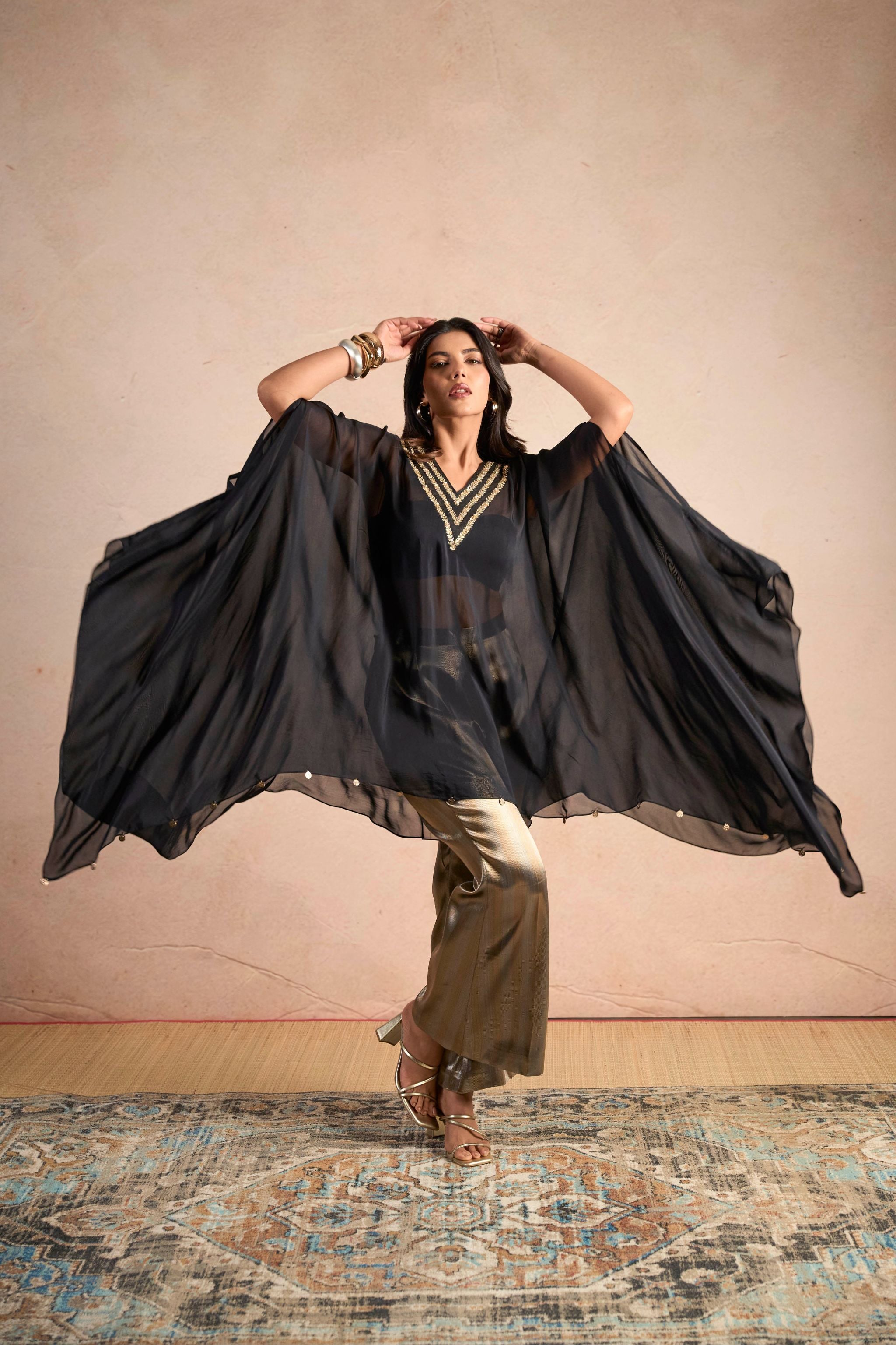 Black Embellished Cape Top & Gold Wide-Leg Pants