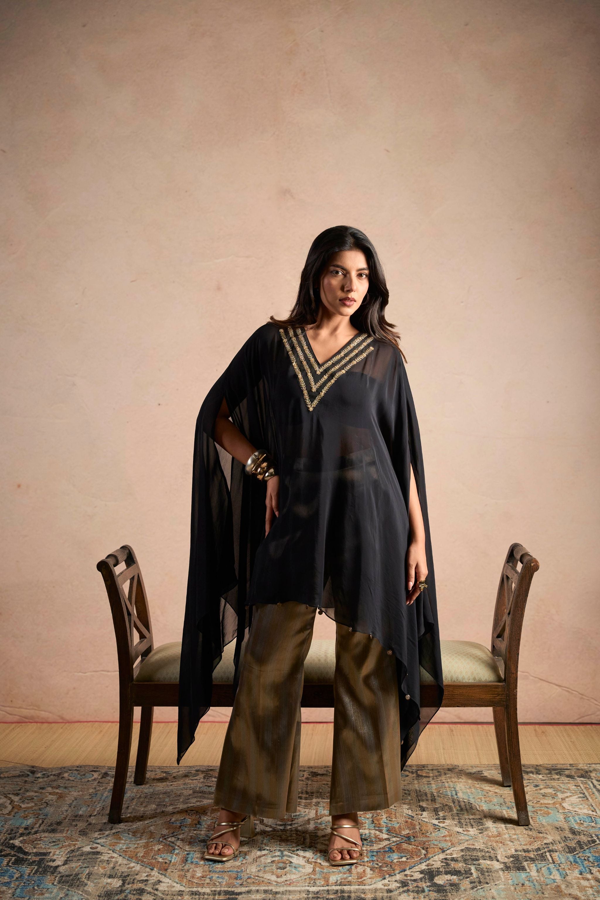 Black Embellished Cape Top & Gold Wide-Leg Pants