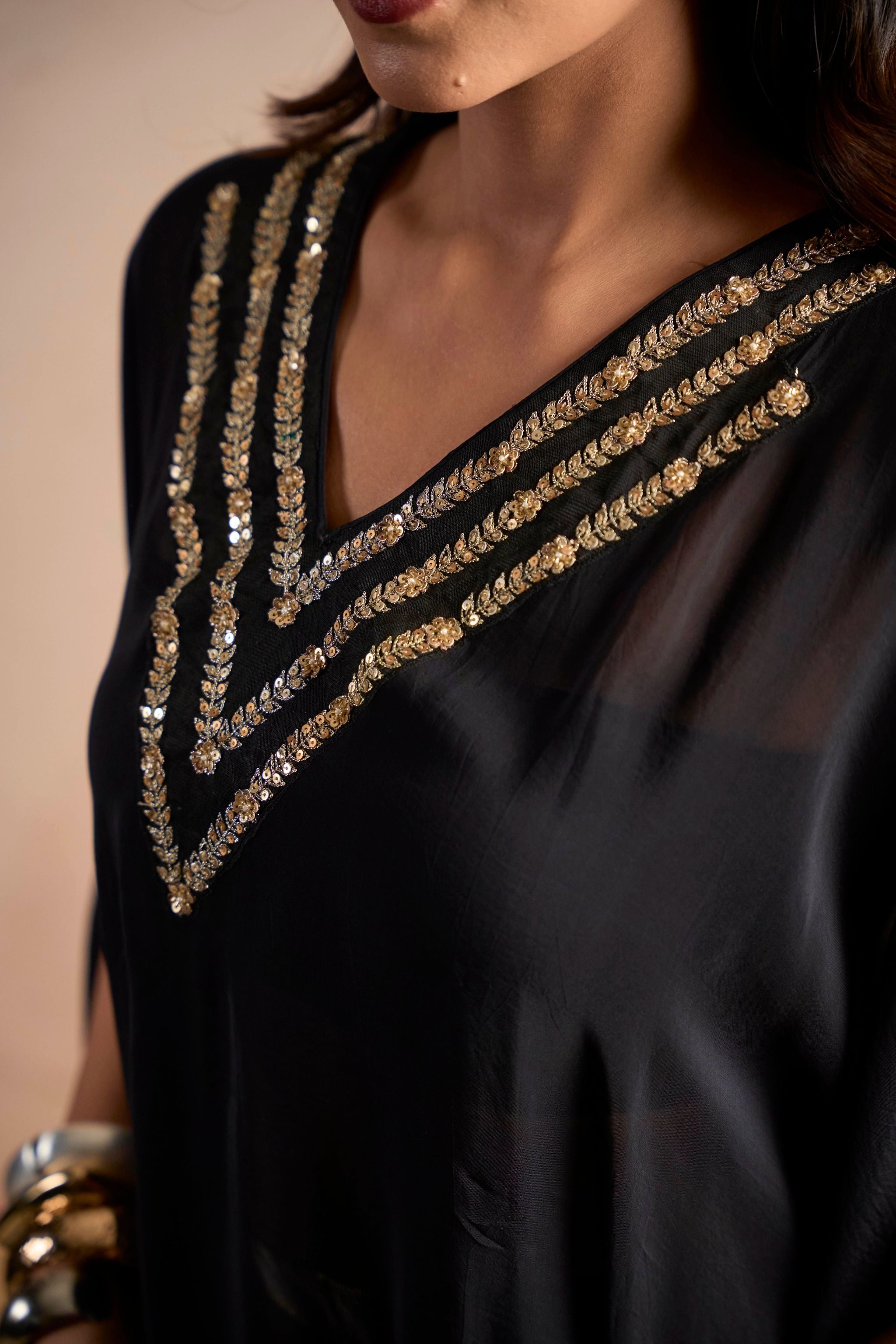 Black Embellished Cape Top & Gold Wide-Leg Pants